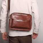 Men's real leather cowhide shoulder bag in brown, perfect for casual daily use.