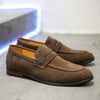 Men's trendy brown suede leather loafers with round toe and comfortable flat sole, perfect for spring fashion.