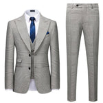 Men's gray plaid slim fit three-piece suit with matching pants, perfect for business casual occasions.