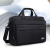 Men's waterproof black Oxford briefcase for business travel with large capacity and multiple pockets.