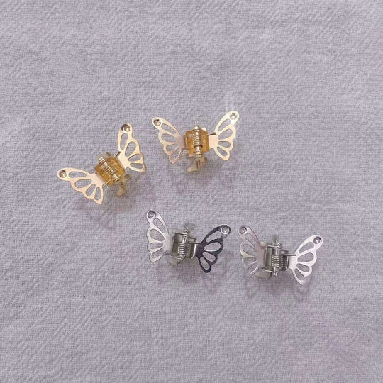 Metal butterfly hair clips in gold and silver, perfect for styling side bangs and managing broken hair.