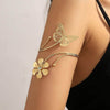 Gold metal butterfly and three-dimensional flower arm decoration with exquisite hollow design.