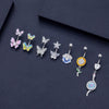 Colorful butterfly and flower design navel studs in silver, perfect for stylish body piercing jewelry.