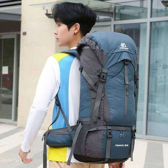 Outdoor sports hiking bag with 70 liters capacity, designed for comfort and durability, worn by a user outdoors.