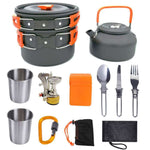 Portable camping cooker stove with utensils, including pots, teapot, cups, and burner for outdoor cooking.