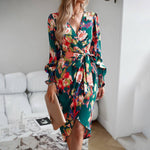 Elegant printed dress with V-neck and long sleeves in dark green floral pattern, perfect for autumn and winter.