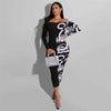 Woman wearing a Printed Maxi Dress in black with abstract patterns, showcasing a slim fit and elegant style.