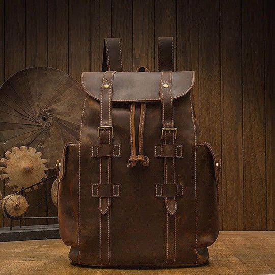 Retro dark brown Crazy Horse leather men's backpack with double straps, perfect for casual daily use.