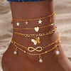 Retro five pointed star butterfly feet chain anklet set in gold, featuring geometric designs and pearl accents.