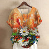 Short-sleeved women's loose top with colorful flower painting design, featuring a floral 3D effect.