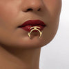 Stylish gold punk lip clip accessory worn on dark red lips, adding a bold geometric flair to lip decoration.