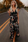 Printed Halter-Neck Maxi Dress featuring ruffles and floral pattern on a model outdoors.