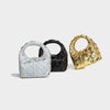 Hand-woven dumpling shape handbags in silver, black, and gold for urban simplicity style.
