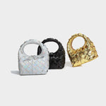 Hand-woven dumpling shape handbags in silver, black, and gold for urban simplicity style.