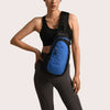 Model showcasing a blue sports shoulder bag designed for leisure travel, featuring a waterproof nylon material.