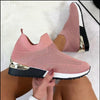 Stylish pink stretch cloth women's shoes with a flat heel and mesh design, perfect for casual wear.