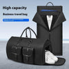 High capacity black business travel bag with shoe compartment and suit storage.