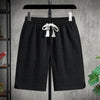 Summer plus size black sports shorts with elastic waist and drawstring, featuring a loose fit and jacquard texture.