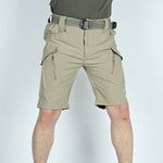 Men's summer tactical five-point shorts in khaki, suitable for outdoor activities, featuring multiple pockets and belt.