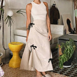 Sweet girls' retro bow high waist skirt in apricot, mid-length A-line style, perfect for a fresh and sweet look.