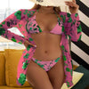 Women's floral printed mesh three-piece swimsuit in pink and green, featuring a bikini and sheer blouse.
