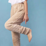 Model showcasing warm beige fleece leggings for women, designed for comfort and style in winter sleepwear and loungewear.