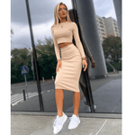 Fashionable women's solid color two-piece top and hip skirt set, featuring a minimalist look with sporty sneakers.