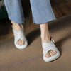 Women's stylish white cross Roman sandals with non-slip sole, perfect for beach wear and casual outings.