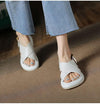 Women's stylish white cross Roman sandals with non-slip sole, perfect for beach wear and casual outings.