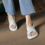 Women's stylish white cross Roman sandals with non-slip sole, perfect for beach wear and casual outings.