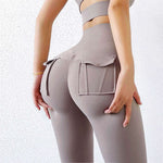 Women's high waist hip trousers in beige with pockets, designed for fitness and yoga practicality.