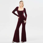 Elegant women's long sleeve velvet jumpsuit in burgundy, featuring a fitted bodice and flared pants.