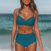 Women's solid color high-waisted bikini in teal, perfect for swimming and beachwear, featuring cross strap design.