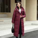 Women's long burgundy down puffer jacket with hood for winter, casual style, and warm comfort.