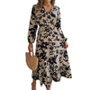 Model wearing Women's Floral Chiffon Ruffle A-Line Dress with black floral print and ruffle detail, holding a straw handbag.