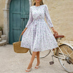 European and American polka dot maxi dress with puff sleeves, high waist, floral pattern in purple, ideal for casual vacations.