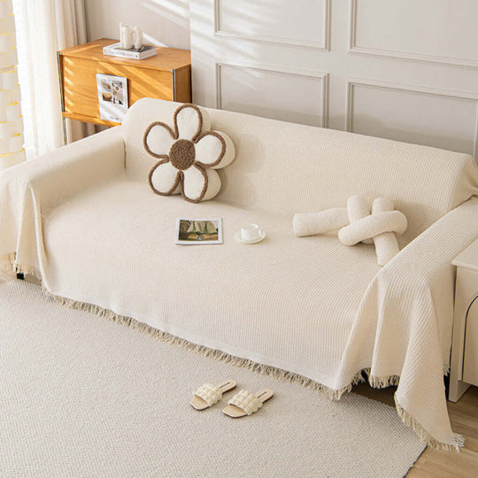 Multi-purpose sofa cover in a living room setting, showcasing its ability as a stylish and functional dust shield on a sofa.