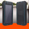 Solar-powered power bank with dual flashlights, universal compatibility, and rugged design in black and blue.